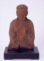 Wooden male god sitting statue